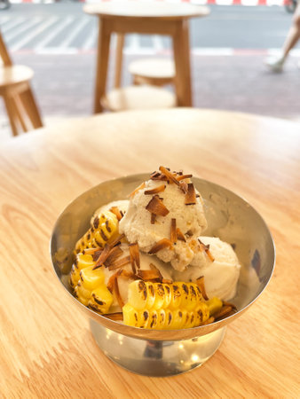Coconut milk ice cream with Thai traditional toppings. Delicious dessert with tropical flavors.の写真素材