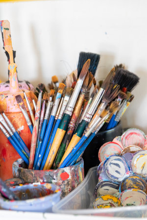 Assortment of paintbrushes with various sizes and colors, conveying creativity.の写真素材