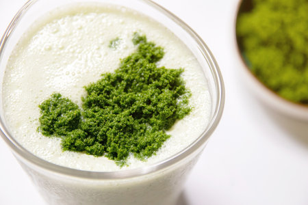 Healthy smoothie with greek yogurt and wolffia globosa in glass isolated on white table background. Wolffia globosa is the nutrient-rich plant-based source of protein and omega3 and vital minerals.の写真素材