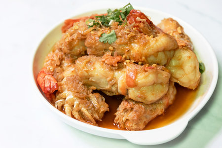 Garlic shrimp stir-fry on white plate; easy and delicious menu.の写真素材