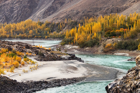 The beautiful Kharmang Pari Valley is the heart of District Kharmang. Turquoise waters a hidden gem lies in district Kharmang of Gilgit Baltistan. A suspension bridge that spans a rushing river.の写真素材