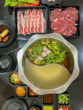 Delicious hot pot meal featuring fresh ingredients and vibrant flavors, perfect for sharing with...