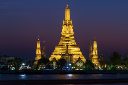 Wat Arun Ratchawararam Ratchawaramahawihan or Wat Arun (Temple of Dawn) is a Buddhist temple along the Chao Phraya river at twilight in Bangkok, Thailand.の写真素材