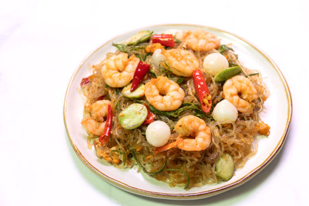 Stir fried vegetables. Stir-fried shrimp noodles asian cuisine gourmet dish indoor setting close-up view flavorful experience.の写真素材