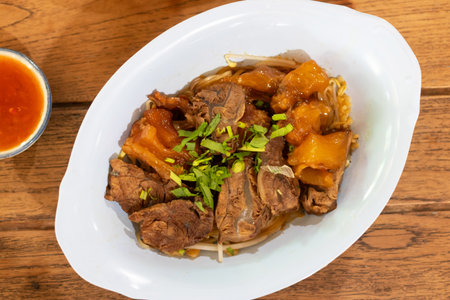 A delicious plate of tender meat garnished with fresh herbs, ready to be enjoyed. Perfect for culinary enthusiasts and food lovers.の写真素材