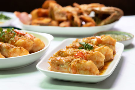 Delicious shrimp dishes presented on elegant plates, showcasing vibrant flavors and an enticing culinary experience.の写真素材