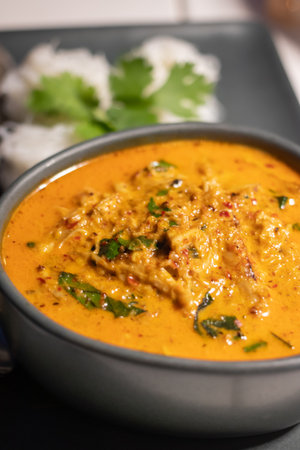 Crab and betel leaf curry. Thai Southern-style crab yellow curry with betel leaves and garlic rice noodles.の写真素材
