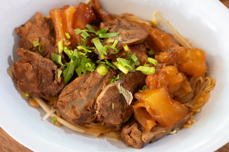 A delicious plate of tender meat garnished with fresh herbs, ready to be enjoyed. Perfect for...