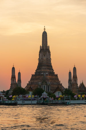 Wat Arun Ratchawararam Ratchawaramahawihan or Wat Arun (Temple of Dawn) is a Buddhist temple along the Chao Phraya river at twilight in Bangkok, Thailand.の写真素材