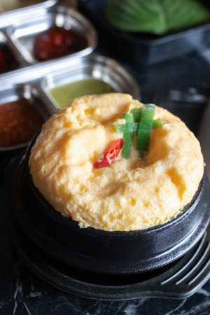 A steamed egg egg custard korean soup bowl scallion chili breakfast savory foam soft steamed