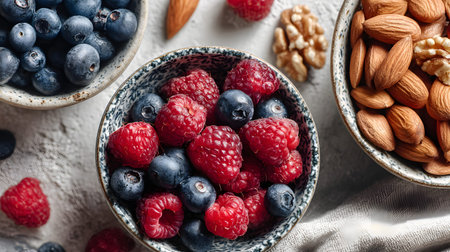 A raspberry blueberry almond walnut nut berry antioxidant healthy snack macro fresh raspberry and blueberry bowl with almond and walnut antioxidantの素材