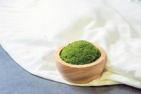 A wolffia globosa in wooden bowl. Wolffia is the nutrient-rich plant-based source of protein and...