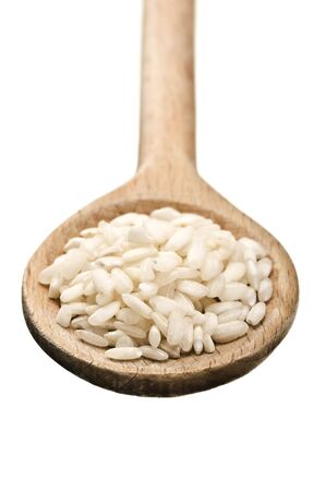 wooden spoon with rice isolated on white backgroundの写真素材