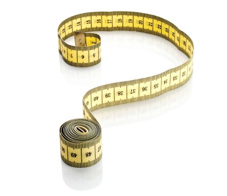 a measuring tape in shape of a question mark on white background の写真素材