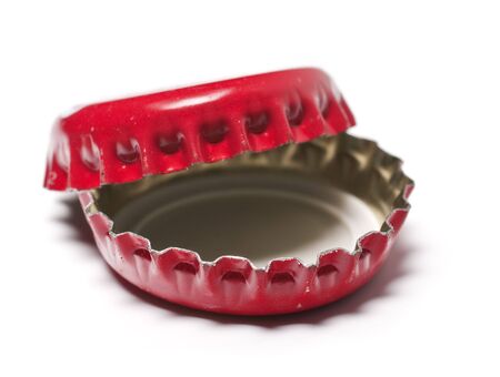 two red bottle caps on white backgroundの写真素材