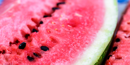 Watermelon fresh sliced of red with magnified macro shot and close up shot on wood table. Background.の写真素材