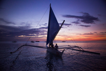 Under sail to sunsetの写真素材
