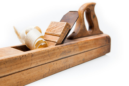 planer with wooden chips, wood shavings isolated on white backgroundの写真素材