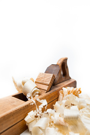 planer with wooden chips, wood shavings isolated on white backgroundの写真素材