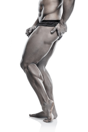 Strong Athletic Man Fitness Model Torso showing naked muscular body and legs isolated on white backgroundの写真素材
