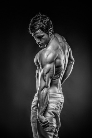 Strong Athletic Man Fitness Model posing back muscles, triceps, latissimusの写真素材