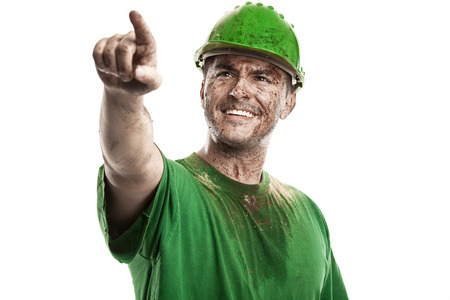 pointing young dirty Worker Man With Hard Hat helmet isolated on White Background