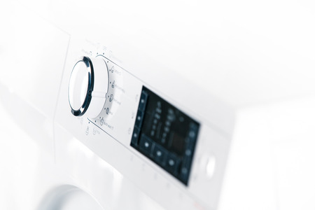 Washing machine control panel detail detail on white background