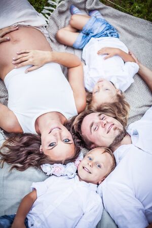 beautiful young family with little sonsの写真素材