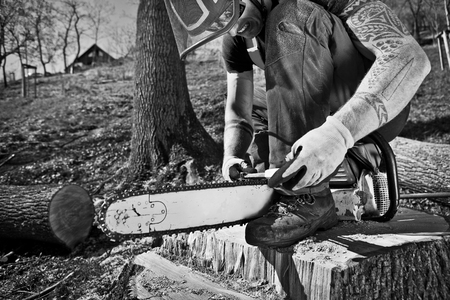 lumberjack with chainsaw after workの写真素材