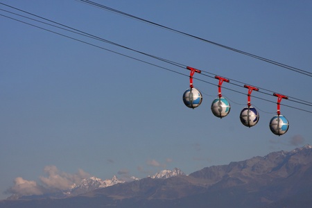 Cable car over mountainsの写真素材