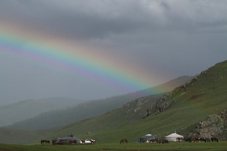 Rainbow over the yurts in Orkhon valleyの写真素材