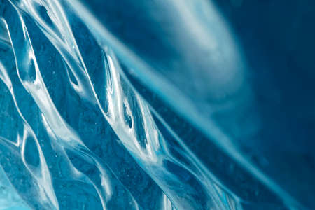 Blue ice waves in the cavernの写真素材