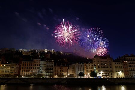 Fireworks on the hill of Fourviere in Lyon city center for the french National Dayの写真素材