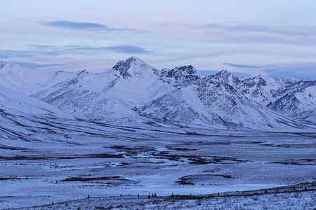 Before sunrise in Tombstone National Park mountains in winterの写真素材