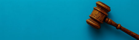 Wooden Gavel on Blue Background Representing Legal Authority, Judgement, Auction or Legislation AI Generativeの素材