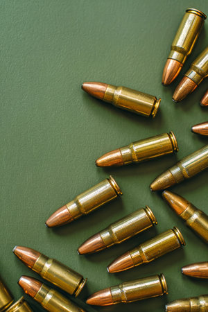 Assorted Rifle Bullets on Olive Green Background Military Ammunition Concept AI Generativeの素材