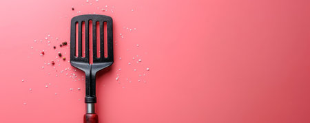 Close up of a Kitchen Spatula on a Red Background with Scattered Seasonings, Ideal for Culinary Blogs, Cooking Articles, Kitchenware Promotions, and Food Photography, High Quality Image Download AI Generativeの素材