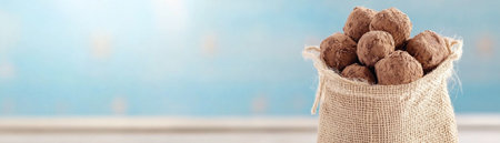 Experience the rustic charm of handmade chocolate truffles, nestled in a sweet burlap bag These artisanal delights offer rich, decadent flavors, a perfect symbol of comfort and warmth Ideal for any occasion, this gift embodies both simple beauty and handcrafted quality Indulge in a truly exquisite treat AI Generativeの素材