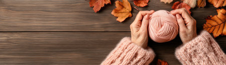 Gentle hands, weathered by time, knit a peach sweater against a rustic backdrop of autumn leaves The scene evokes warmth, tradition, and cozy craftsmanship Vibrant yarn and vintage surroundings create a captivating image of autumnal beauty, perfect for representing handmade goods and fall's nostalgic charm AI Generativeの素材