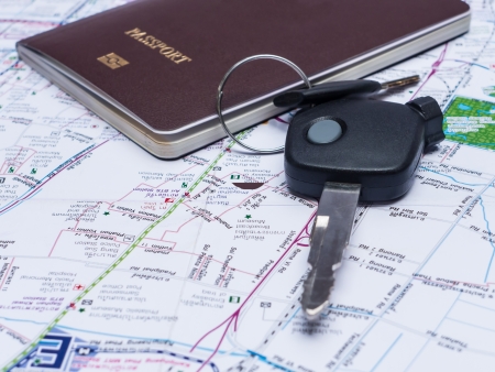 Key from the car and passport on mapの写真素材