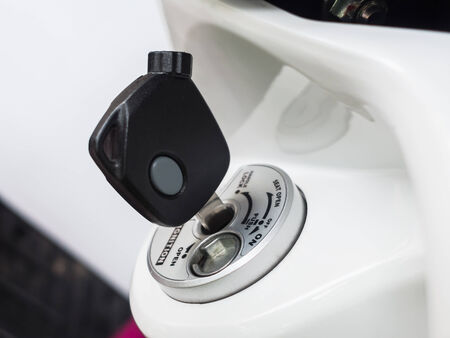 Motorcycle key in ignitionの写真素材