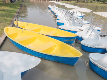 Fiberglass Rowing Boats and Pedal Boats On Waterの写真素材
