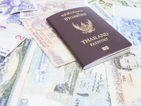 Closeup heap of international money and passport for backgroundの写真素材