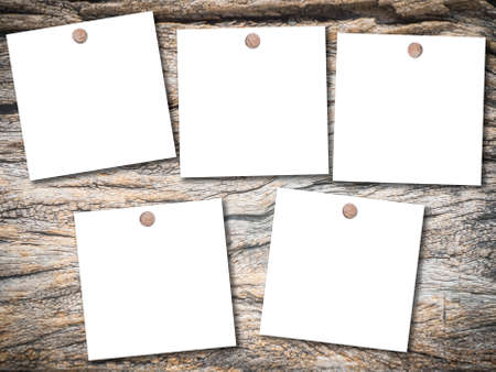 White note papers on  old brown wood for backgroundの写真素材