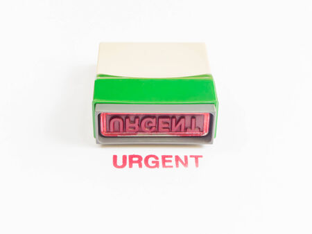 stamp with urgent in red ink isolated on white backgroundの写真素材