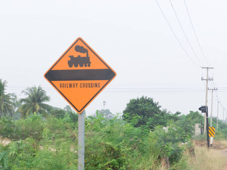 Railroad Level Crossing Sign on yellow board の写真素材