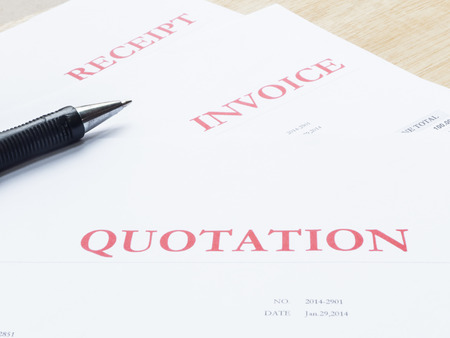 Pen with business document white papers on wood tableの写真素材