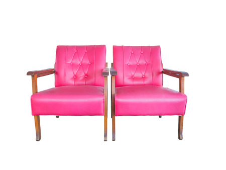 Twin pink old sofa chair isolated on white backgroundの写真素材