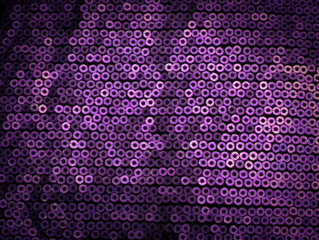 Violet sequins embroidered on black fabric,background