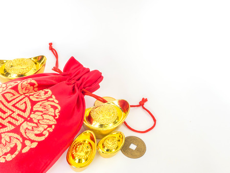 Red silky money bag with ancient Chinese golden ingots and coin : lucky pouchの写真素材